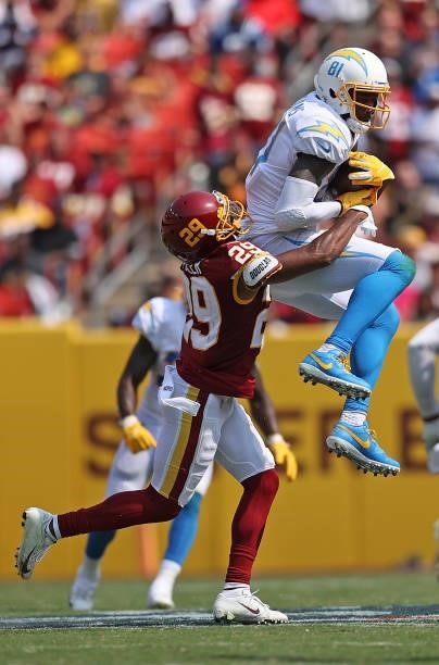 Mike Williams of the Los Angeles Chargers makes a catch defended by Kendall Fuller of the Washington Football Team during the second quarter at...
