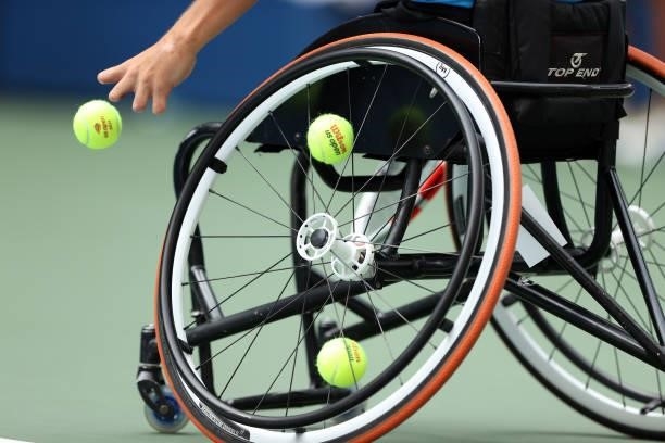 Detailed view of tennis balls in the wheel of a wheelchair is seen as Niels Vink of the Netherlands prepares to serve against Dylan Alcott of...