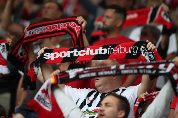 Fans holding their scarfs are seen prior to the Bundesliga match between Sport-Club Freiburg and 1. FC Köln at Dreisamstadion on September 11, 2021...