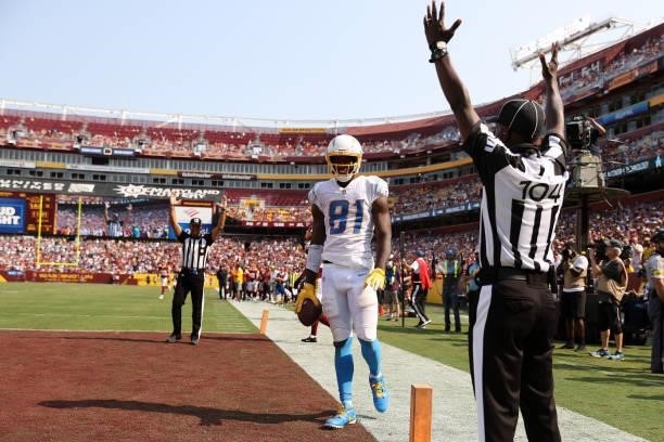 Mike Williams of the Los Angeles Chargers celebrates after catching a three yard touchdown reception during the fourth quarter against the Washington...