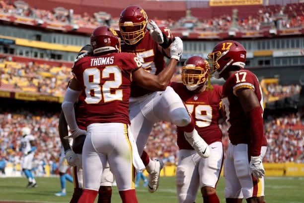 Logan Thomas of the Washington Football Team celebrates his touchdown reception against the Los Angeles Chargers with Brandon Scherff during the...
