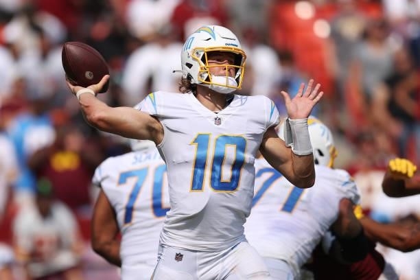Justin Herbert of the Los Angeles Chargers throws a pass during the second half against the Washington Football Team at FedExField on September 12,...