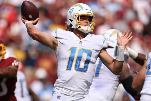 Justin Herbert of the Los Angeles Chargers throws a pass during the second half against the Washington Football Team at FedExField on September 12,...