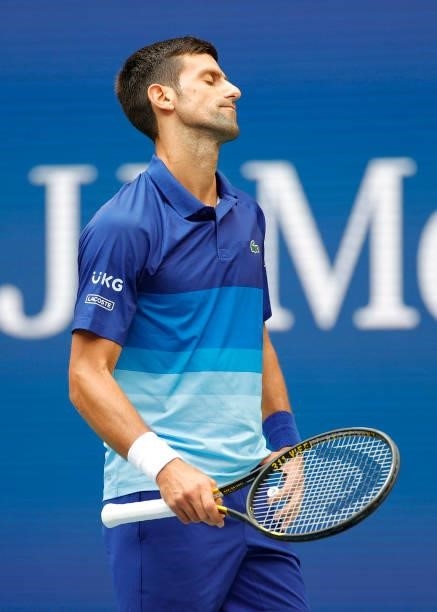 Novak Djokovic of Serbia reacts as he plays against Daniil Medvedev of Russia in the first set of the Men's Singles final match on Day Fourteen of...