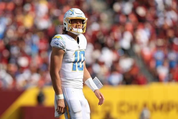 Justin Herbert of the Los Angeles Chargers looks on during the game against the Washington Football Team at FedExField on September 12, 2021 in...