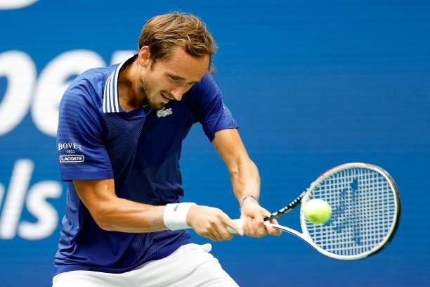 Daniil Medvedev of Russia returns the ball against Novak Djokovic of Serbia in the first set of the Men's Singles final match on Day Fourteen of the...
