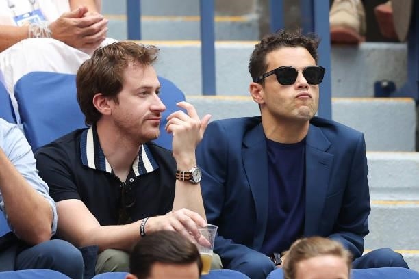 Actors Joseph Mazzello and Rami Malek watch the Men's Singles final match between Daniil Medvedev of Russia and Novak Djokovic of Serbia on Day...