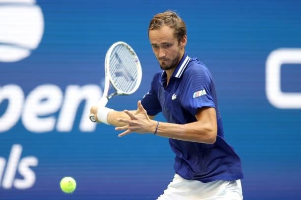Daniil Medvedev of Russia returns the ball against Novak Djokovic of Serbia in the first set of the Men's Singles final match on Day Fourteen of the...