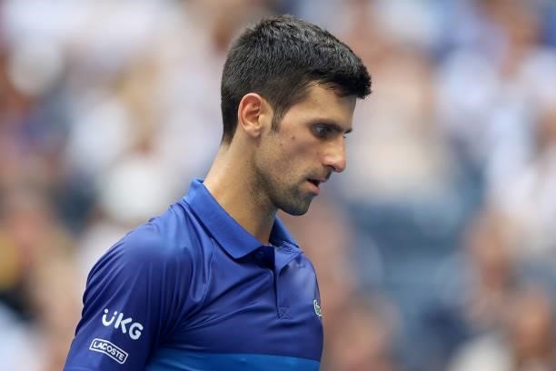 Novak Djokovic of Serbia looks on as he plays against Daniil Medvedev of Russia in the first set of the Men's Singles final match on Day Fourteen of...