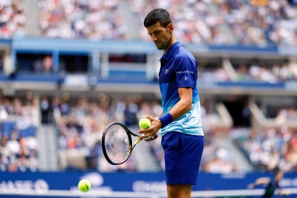 Novak Djokovic of Serbia prepares to serve the ball against Daniil Medvedev of Russia during their Men's Singles final match on Day Fourteen of the...