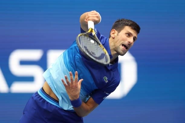 Novak Djokovic of Serbia serves the ball against Daniil Medvedev of Russia during their Men's Singles final match on Day Fourteen of the 2021 US Open...