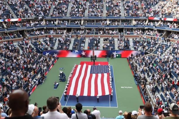 General view is seen as members of the Military unfurl the American flag before the Men's Singles final match between Daniil Medvedev of Russia and...