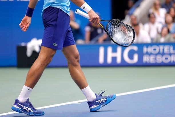 Detailed view of a broken racket belonging to Novak Djokovic of Serbia is seen as he plays against Daniil Medvedev of Russia during the second set of...