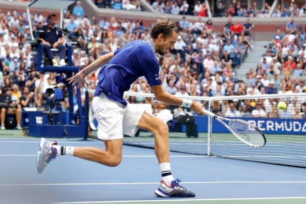 Daniil Medvedev of Russia returns the ball against Novak Djokovic of Serbia during their Men's Singles final match on Day Fourteen of the 2021 US...