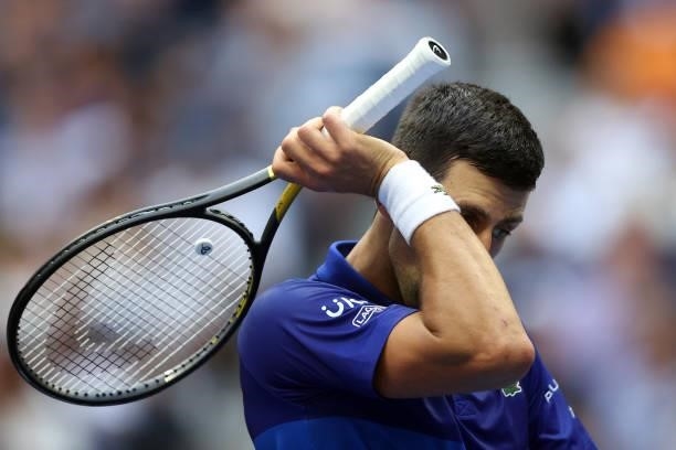 Novak Djokovic of Serbia reacts as he plays against Daniil Medvedev of Russia during their Men's Singles final match on Day Fourteen of the 2021 US...