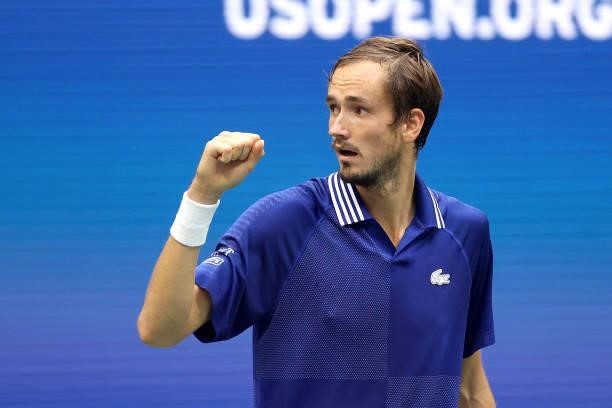 Daniil Medvedev of Russia celebrates breaking Novak Djokovic of Serbia during the third set of their Men's Singles final match on Day Fourteen of the...