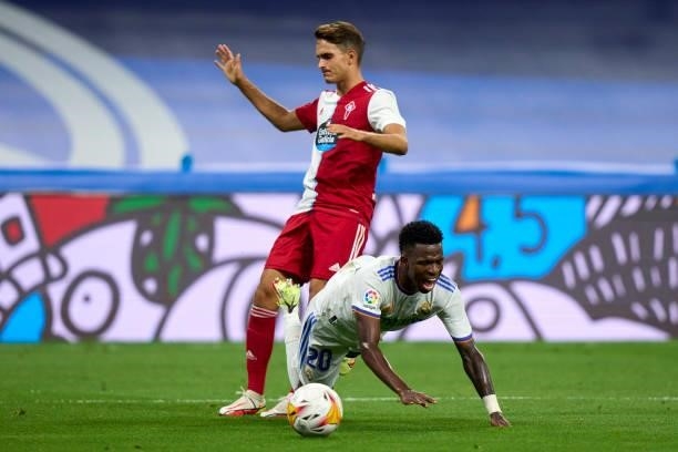Vinicius Junior of Real Madrid battle for the ball with Denis Suarez of RC Celta moment of penalty during the La Liga Santader match between Real...