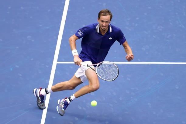Daniil Medvedev of Russia returns the ball against Novak Djokovic of Serbia during their Men's Singles final match on Day Fourteen of the 2021 US...