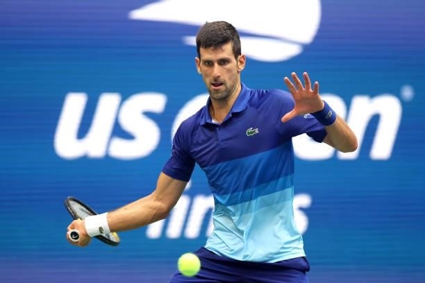 Novak Djokovic of Serbia returns the ball against Daniil Medvedev of Russia during their Men's Singles final match on Day Fourteen of the 2021 US...