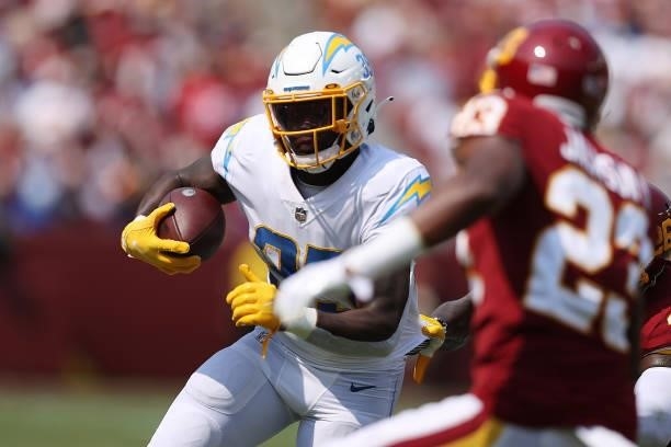 Larry Rountree III of the Los Angeles Chargers runs with the ball during the first quarter against the Washington Football Team at FedExField on...
