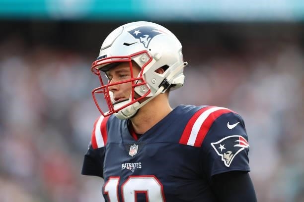 Mac Jones of the New England Patriots reacts during the first half against the Miami Dolphins at Gillette Stadium on September 12, 2021 in...