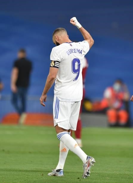 Karim Benzema of Real Madrid celebrates after scoring their team's 5th goal from the penalty spot during the La Liga Santander match between Real...