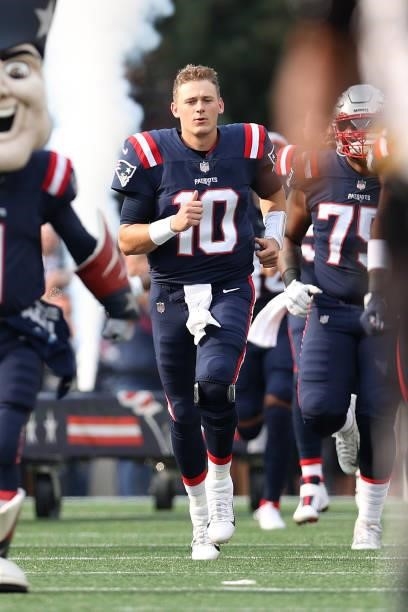 Mac Jones of the New England Patriots runs onto the field prior to the game against the Miami Dolphins at Gillette Stadium on September 12, 2021 in...