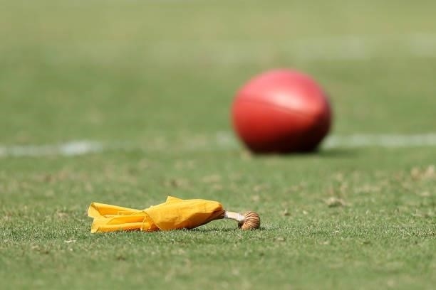 Flag and a football are seen before the game between the Washington Football Team and the Los Angeles Chargers at FedExField on September 12, 2021 in...
