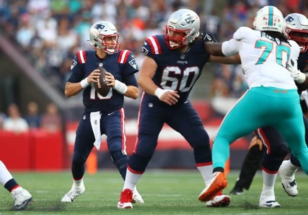 Mac Jones of the New England Patriots looks to pass during the game against the Miami Dolphins at Gillette Stadium on September 12, 2021 in...