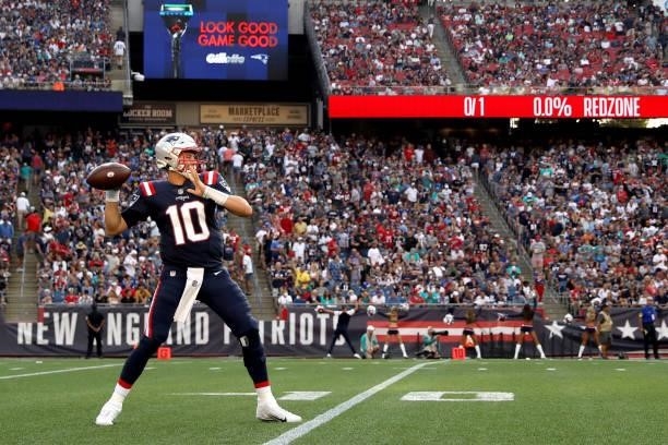 Mac Jones of the New England Patriots looks to pass during the first half against the Miami Dolphins at Gillette Stadium on September 12, 2021 in...