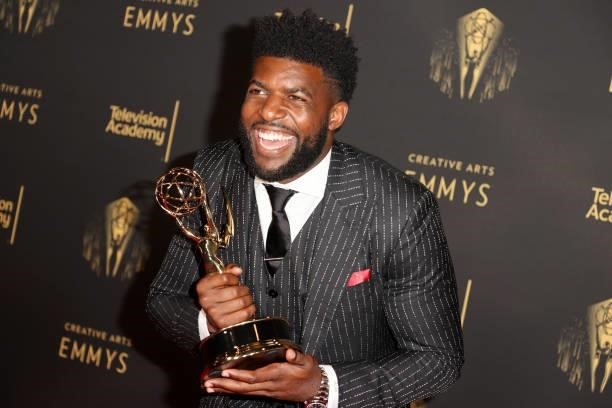 Emmanuel Acho poses with the award for Outstanding Short Form Nonfiction or Reality Series for "Uncomfortable Conversations with a Black Man