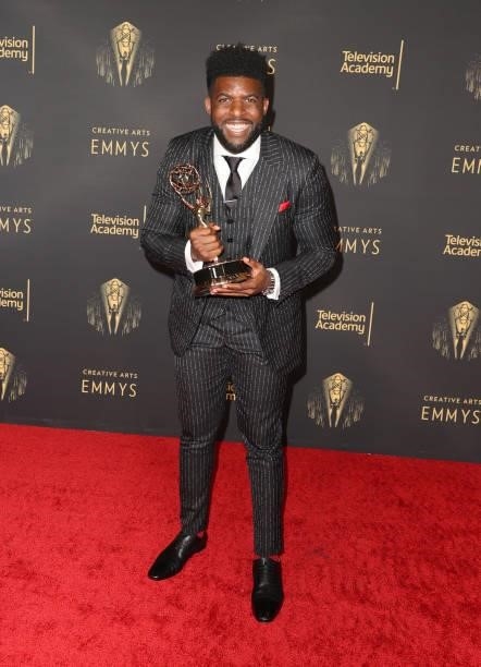 Emmanuel Acho poses with the award for Outstanding Short Form Nonfiction or Reality Series for "Uncomfortable Conversations with a Black Man