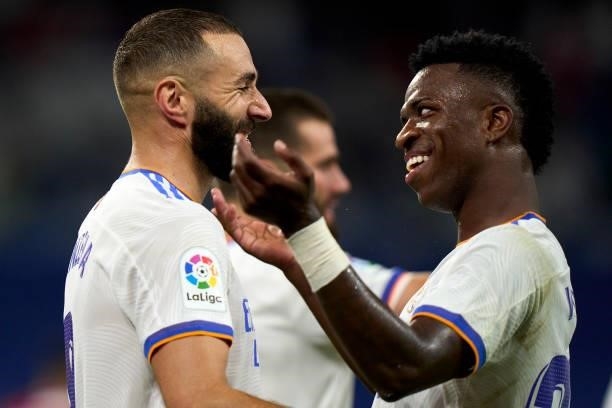 Vinicius Junior and Karim Benzema of Real Madrid celebrates their fifth goal during the La Liga Santader match between Real Madrid CF and RC Celta de...