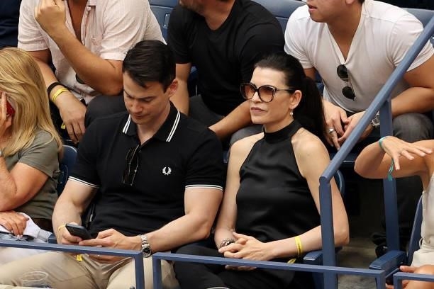 Actress Julianna Margulies watches the Men's Singles final match between Daniil Medvedev of Russia and Novak Djokovic of Serbia on Day Fourteen of...