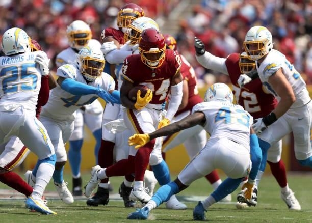 Antonio Gibson of the Washington Football Team carries the ball during the game against the Los Angeles Chargers at FedExField on September 12, 2021...