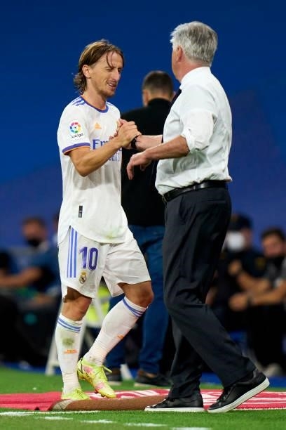Luka Modric and Ancelotti head Coach of Real Madrid salutes during the La Liga Santader match between Real Madrid CF and RC Celta de Vigo at Estadio...