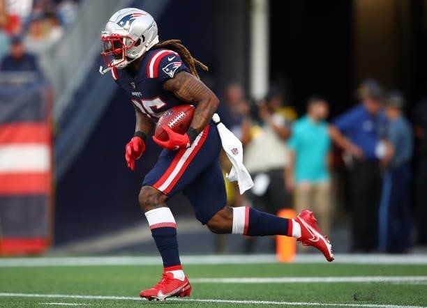 Brandon Bolden of the New England Patriots runs with the ball against the Miami Dolphins at Gillette Stadium on September 12, 2021 in Foxborough,...