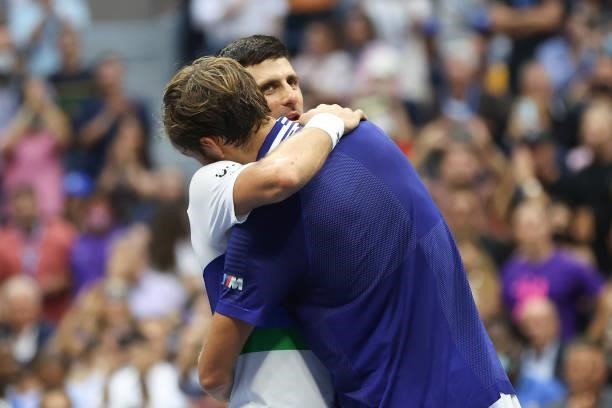 Daniil Medvedev of Russia and Novak Djokovic of Serbia embrace after Medvedev won their Men's Singles final match on Day Fourteen of the 2021 US Open...