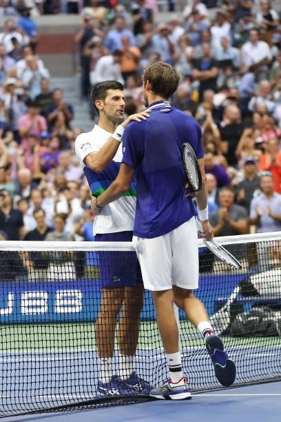 Daniil Medvedev of Russia talks with Novak Djokovic of Serbia after winning their Men's Singles final match on Day Fourteen of the 2021 US Open at...