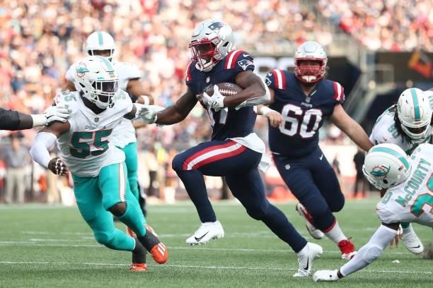 Damien Harris of the New England Patriots runs with the ball during the first half against the Miami Dolphins at Gillette Stadium on September 12,...