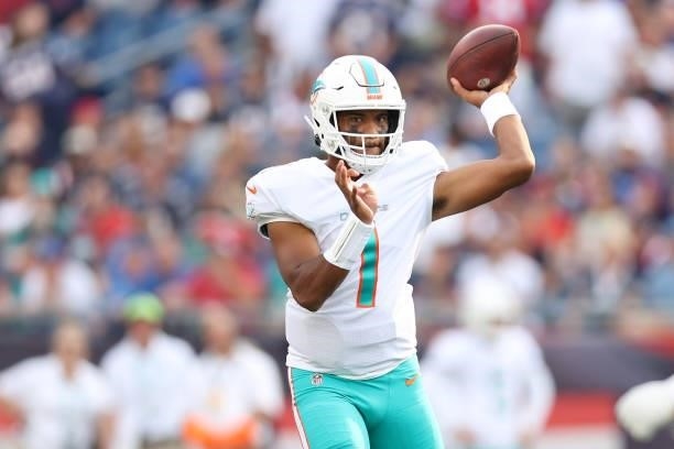 Tua Tagovailoa of the Miami Dolphins throws a pass during the game against the New England Patriots at Gillette Stadium on September 12, 2021 in...