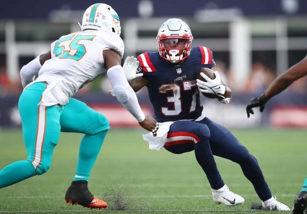 Damien Harris of the New England Patriots carries the ball against the Miami Dolphins during the game at Gillette Stadium on September 12, 2021 in...