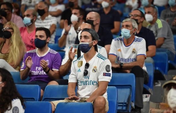 Real Madrid fans watch their team play during the La Liga Santander match between Real Madrid CF and RC Celta de Vigo at Estadio Santiago Bernabeu on...