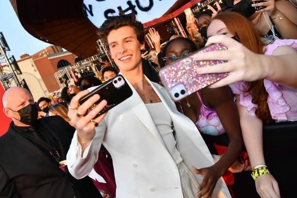 Shawn Mendes poses for a selfie with fans during the 2021 MTV Video Music Awards at Barclays Center on September 12, 2021 in the Brooklyn borough of...