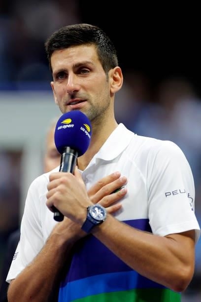 Runner up Novak Djokovic of Serbia speaks during the trophy ceremony after being defeated by Daniil Medvedev of Russia during their Men's Singles...
