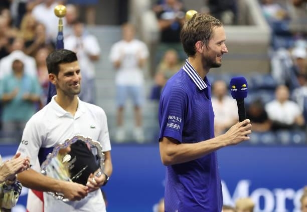 Daniil Medvedev of Russia smiles as he speaks during the trophy ceremony after defeating Novak Djokovic of Serbia to win the Men's Singles final...