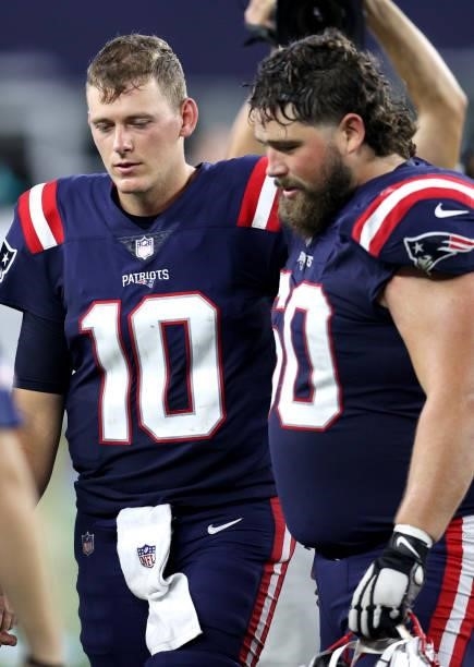 Mac Jones and David Andrews of the New England Patriots react after losing to the Miami Dolphins at Gillette Stadium on September 12, 2021 in...