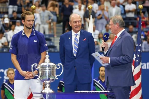 President, Michael McNulty, speaks as Daniil Medvedev of Russia and Stan Smith look on during the trophy ceremony after Medvedev defeated Novak...