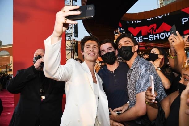 Shawn Mendes poses for a selfie photo with fans during the 2021 MTV Video Music Awards at Barclays Center on September 12, 2021 in the Brooklyn...