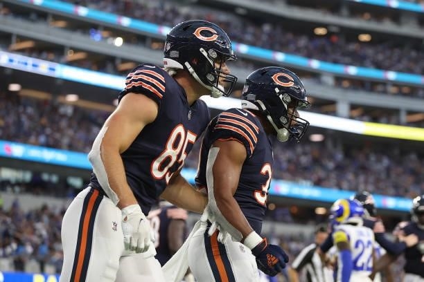 David Montgomery of the Chicago Bears celebrates a touchdown with Cole Kmet \ at SoFi Stadium on September 12, 2021 in Inglewood, California.
